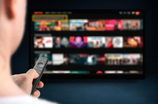 Person browsing movies on a tablet